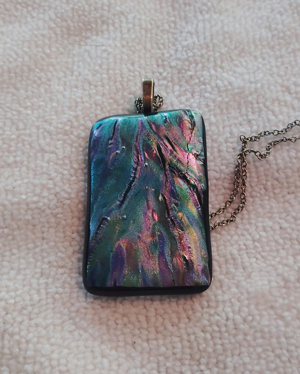 Textured rectangular glass pendant swirling teal, pink and violet, bronze chain